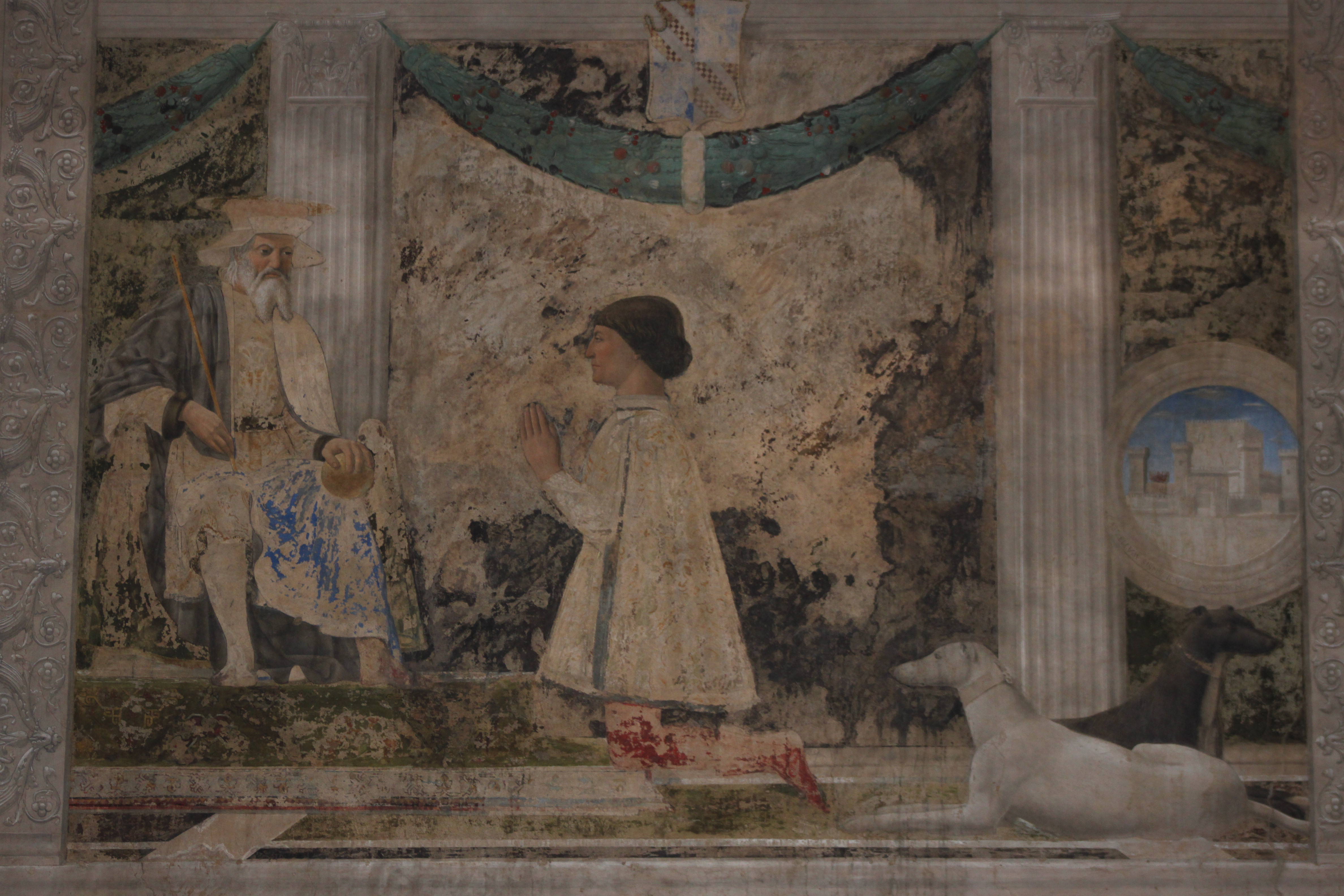 Sigismondo kneeling with the greyhounds